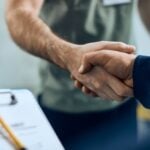 Sheridan’s Trusted HVAC Experts For Over 40 Years 1 Two people shaking hands